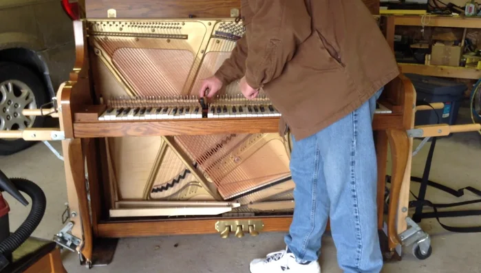 Remove the keys: Carefully lift the keys straight up from their pins to avoid damaging the holes.