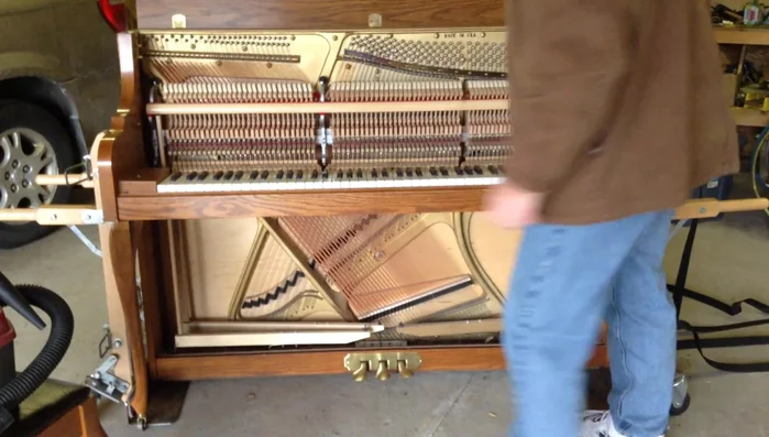 Remove the piano action: Unscrew the nose bolts and carefully lift the action, being mindful of the dampers.