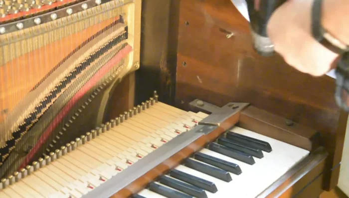 Remove the key stop rail (the piece holding the keys down).