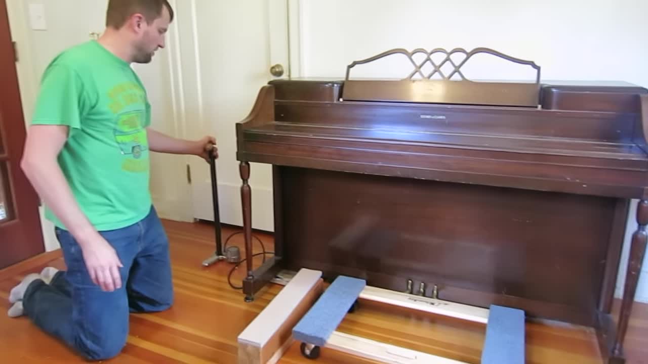 Inflated basketball positioned under the piano