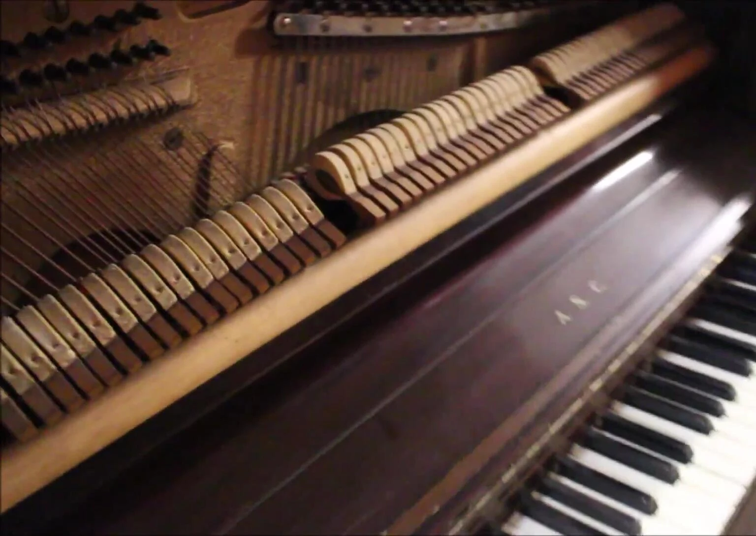 A shot of the presenter playing the piano