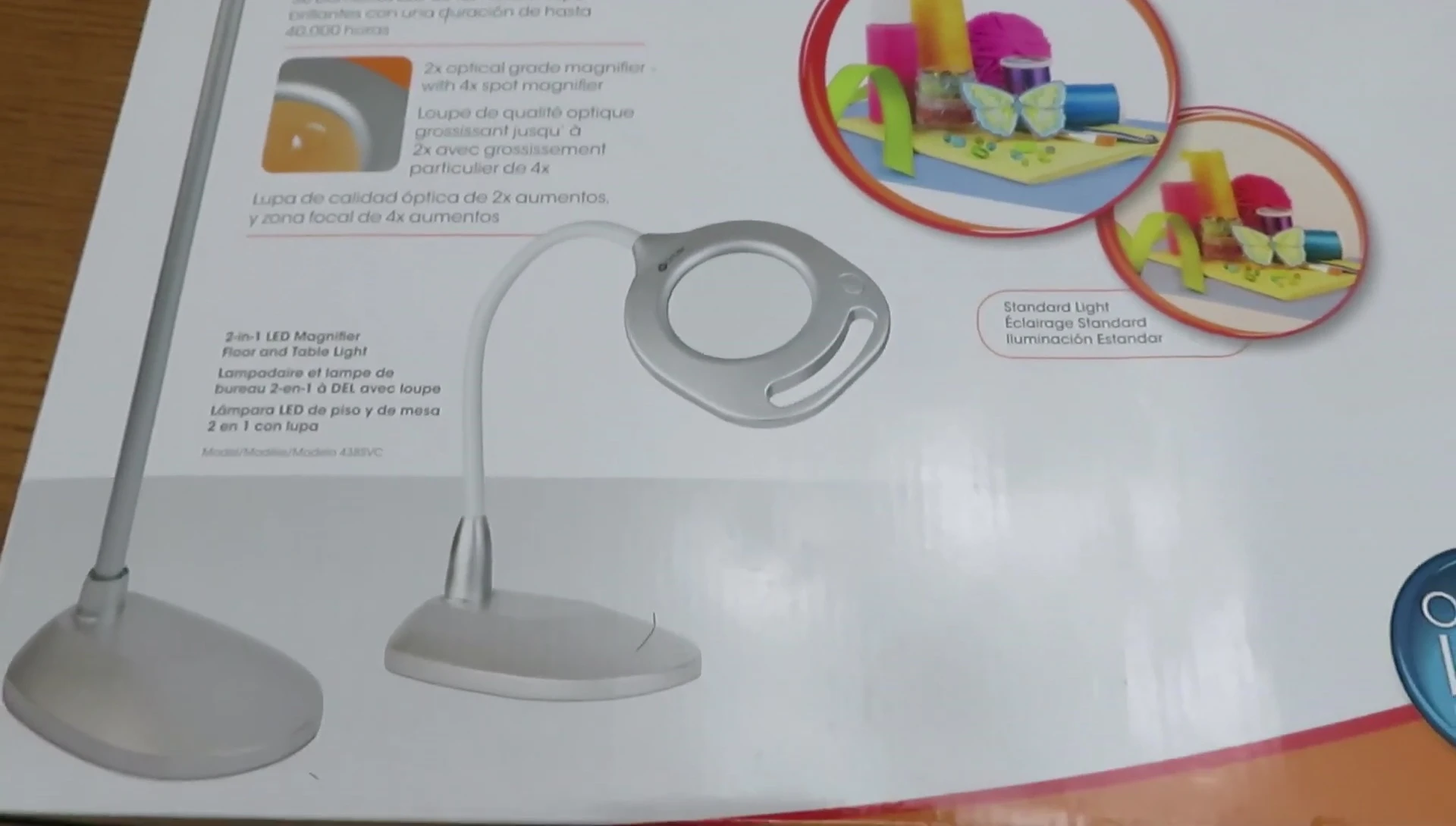 The OTTLITE lamp box being opened, revealing the components.