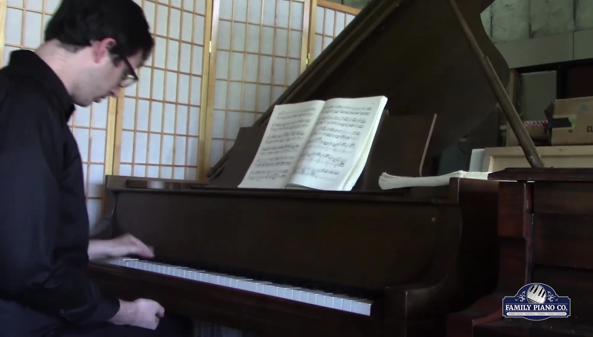 Pianist demonstrating the use of the soft pedal.